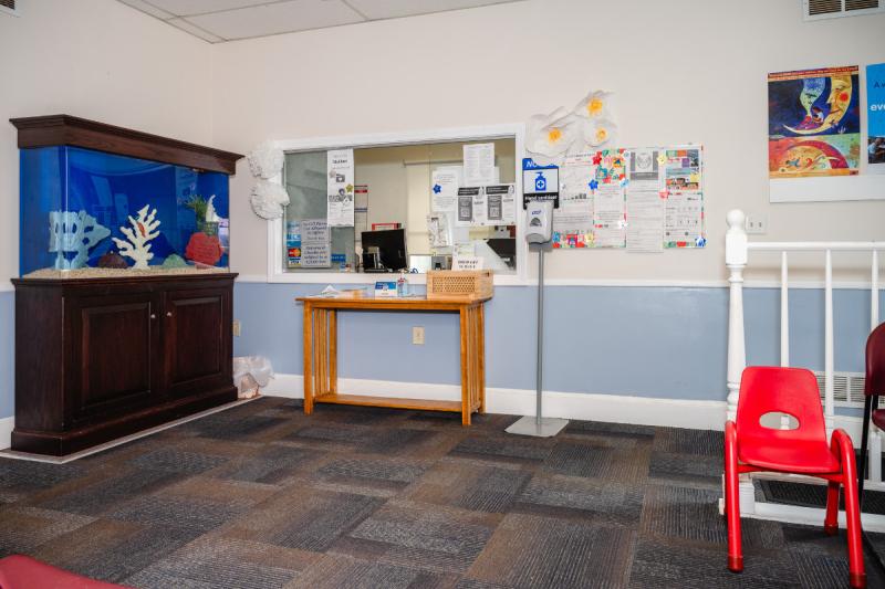 a pediatric waiting room with an aquarium